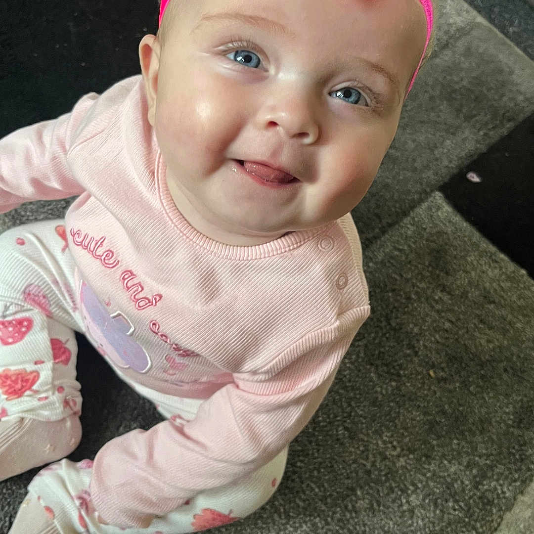 Harper joined the competition — help win amazing prizes! accessories, baby, babylaughing, bodypart, clothing, costume, face, happy, head, headband, laughing, mouth, pants, person, photography, portrait, purple, smile, t_shirt, teeth