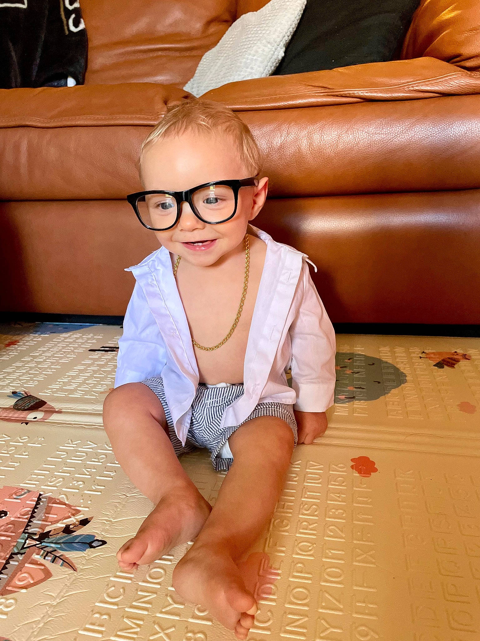 Bryce joined the competition — help win amazing prizes! comfort, couch, eyewear, finger, flash_photography, floor, flooring, glasses, goggles, hairstyle, happy, joint, person, smile, studio_couch, sunglasses, textile, thigh, toddler, vision_care