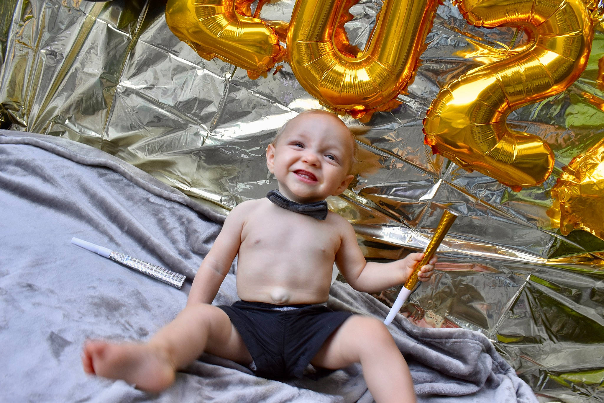 Bryce is registered to the contest to win money with this photo: art, baby, barechested, child, event, eye, fun, happy, joy, leisure, light, metal, person, photograph, recreation, shorts, sitting, smile, snapshot, toddler
