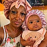 Genesis joined the competition — help win amazing prizes! grandma, baby, child, woman, portrait, indoor, headwear, bonnet, pink, clothing, face, person, holding, cute, plush, family, love, skin, expression, smile