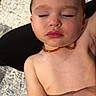 toddler, child, sleeping, necklace, diaper, skin, peaceful, resting, baby, indoors, portrait, closeup, face, arm, bare_chest, relaxation, soft_light, texture, background, comfort