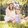 Itai is registered to the contest to win money with this photo: child, toddler, woman, outdoor, grass, sunlight, nature, tree, leaves, dress, overalls, portrait, family, baby, people, summer, greenery, happy, daylight, park