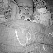 Céléna participe au concours pour gagner de l'argent avec cette photo : baby, infant, sleeping, blanket, plush_toy, crocheted_octopus, pillow, pacifier, hand, cozy, monochrome, portrait, cute, bedtime, nursery, bedding, soft_toys, peaceful, face, newborn