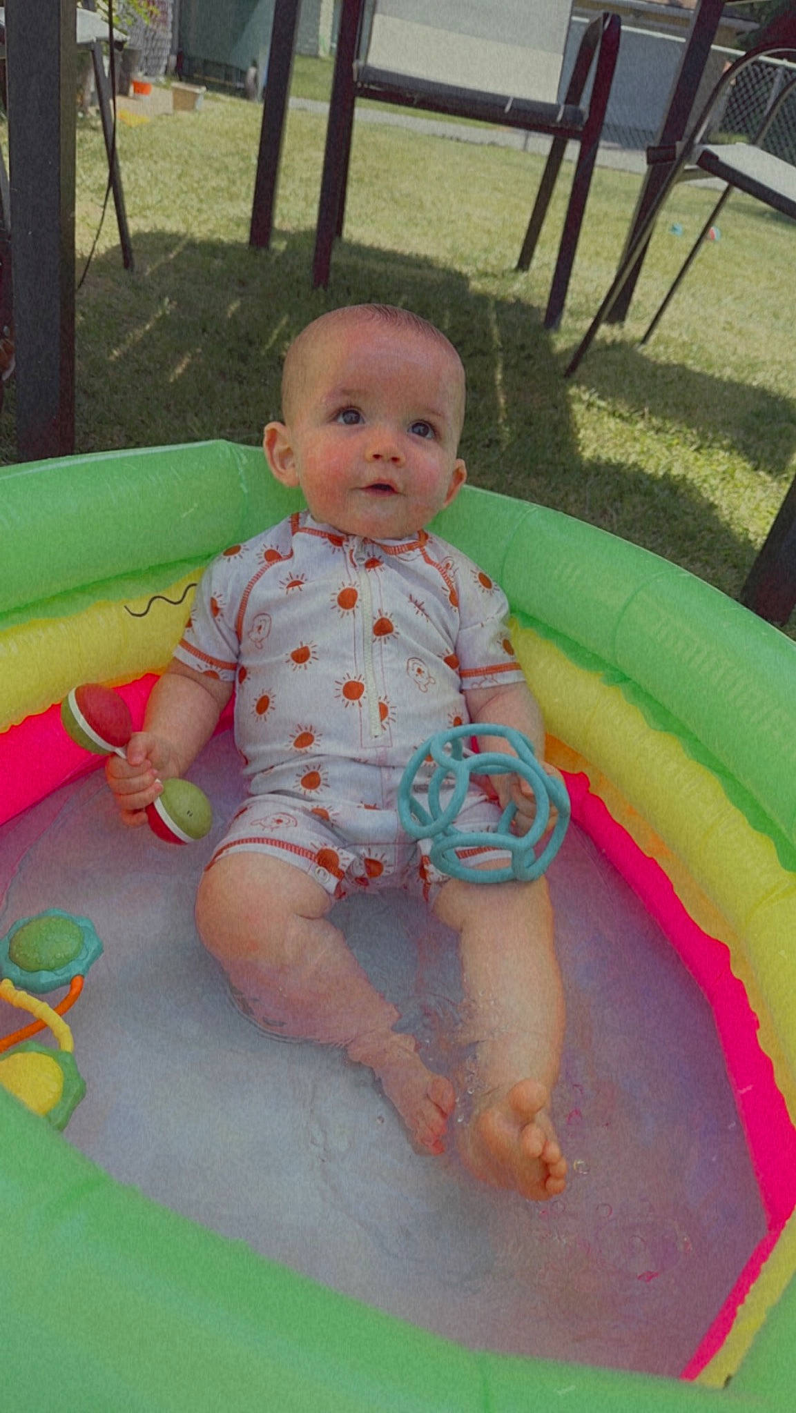 Liam is registered to the contest to win money with this photo: baby, baby_products, baby_toddler_clothing, barefoot, child, facial_expression, foot, fun, grass, leisure, person, pink, play, playground, recreation, sitting, skin, smile, thigh, toddler