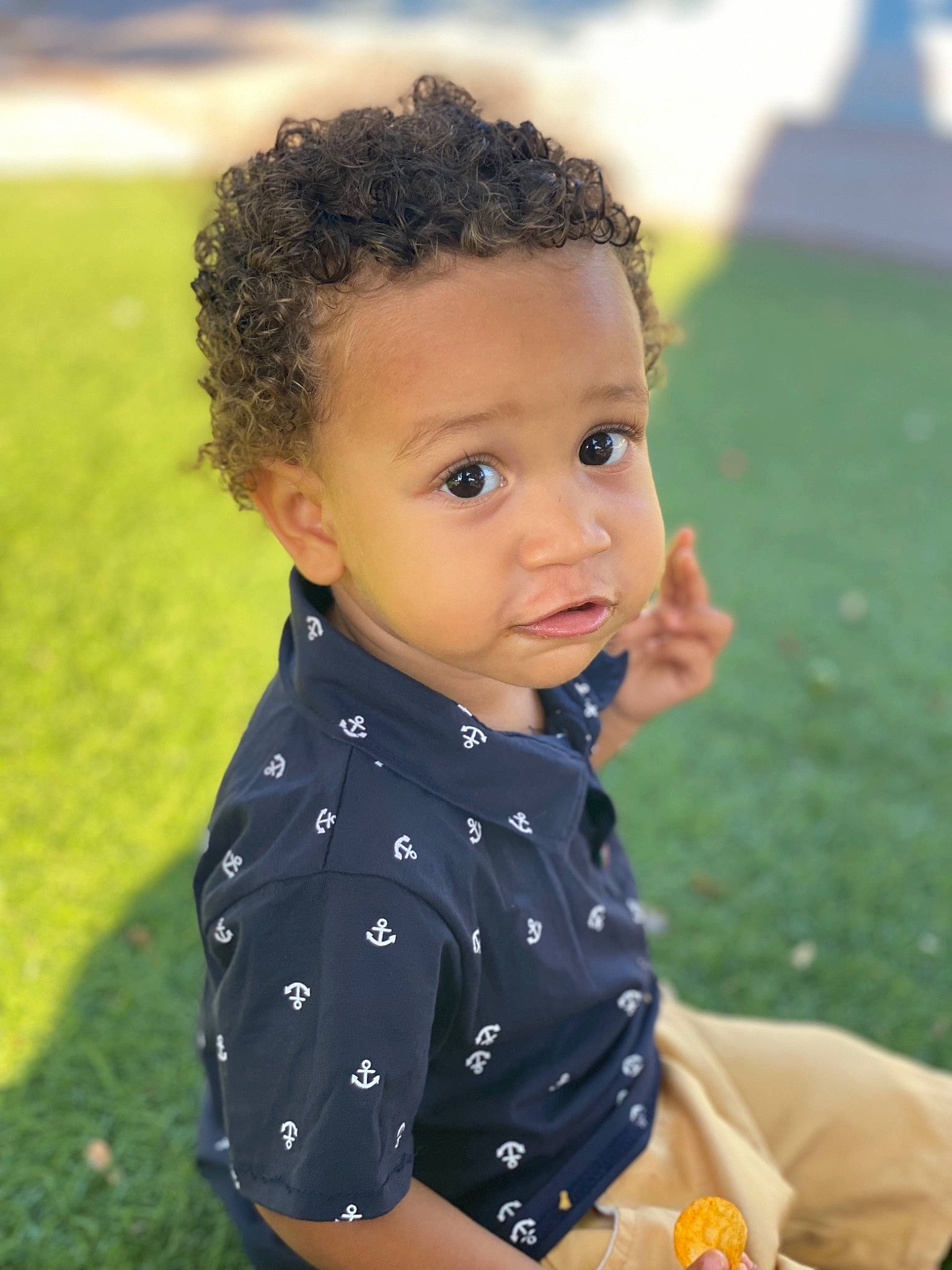 Jayson participe au concours pour gagner de l'argent avec cette photo : baby, baby_toddler_clothing, child, chin, fun, grass, grassland, happy, iris, leisure, lip, nose, pattern, people_in_nature, person, recreation, sitting, sleeve, summer, tie