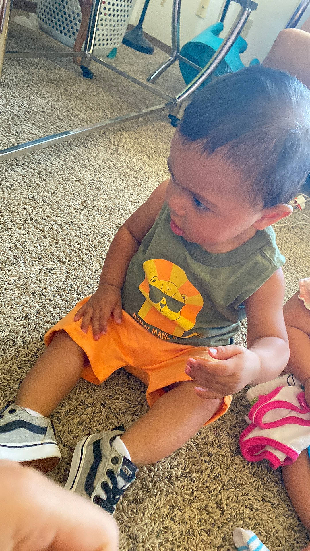 Ezra Mozes joined the competition — help win amazing prizes! baby_toddler_clothing, blue, child, flooring, foot, fun, grass, happy, human_leg, leg, leisure, person, recreation, shoe, shorts, sitting, sneakers, soil, t_shirt, thigh