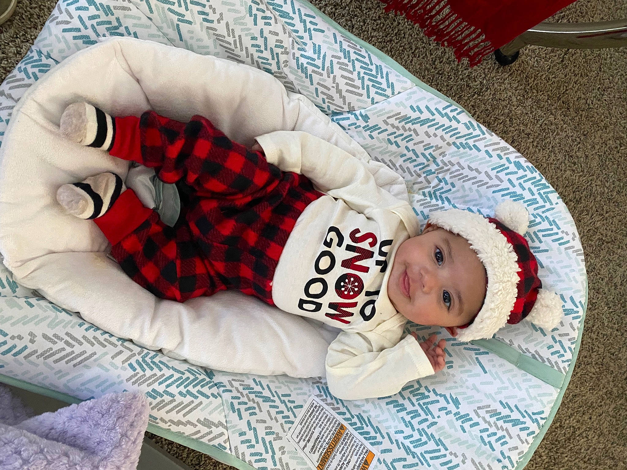 Ezra Mozes joined the competition — help win amazing prizes! baby, baby_sleeping, baby_toddler_clothing, carmine, child, comfort, couch, event, flooring, headwear, joy, lap, linens, pattern, person, plaid, sleeve, sock, tartan, textile