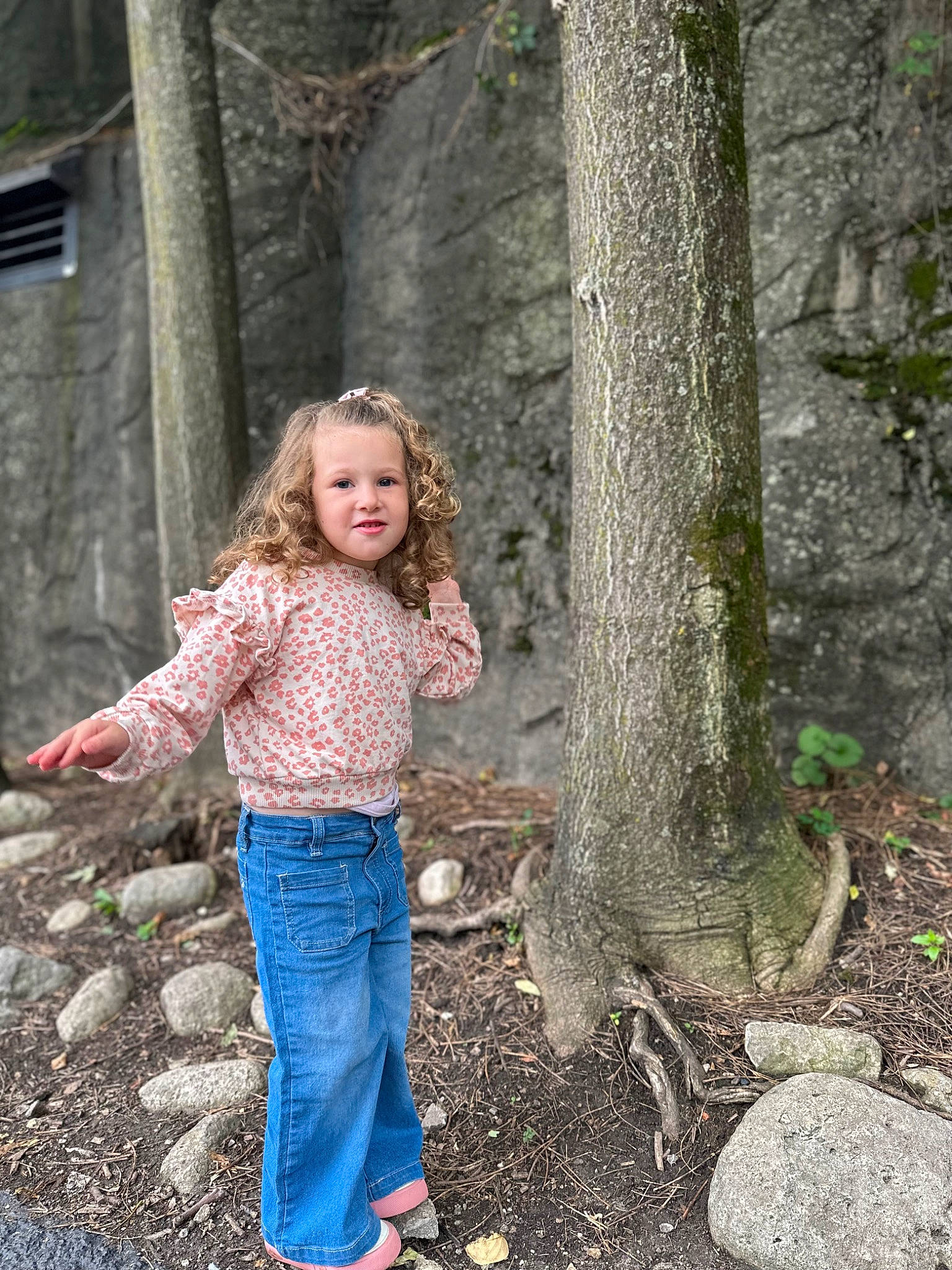 Emery is registered to the contest to win money with this photo: blond, branch, denim, eye, forest, fun, grass, happy, joy, people_in_nature, person, plant, smile, soil, toddler, tree, trunk, wilderness, wood, woodland