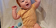 Derek is registered to the contest to win money with this photo: accessories, baby, bodypart, candy, egg, face, finger, food, hand, head, medication, person, photography, pill, portrait, sphere, sweets, toe, toy, wood