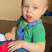 Emmett J Sabat is registered to the contest to win money with this photo: applique, baby, bodypart, clothing, couch, face, finger, furniture, hand, happy, head, jeans, pants, pattern, person, photography, portrait, sitting, smile, t_shirt