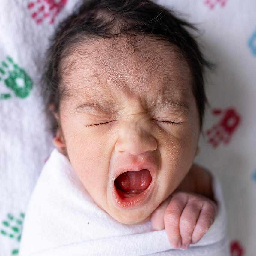 Ovi is registered to the contest to win money with this photo: newborn, baby, yawning, wrapped, blanket, infant, cute, sleepy, face, hand, skin, soft, closeup, portrait, child, indoors, cozy, expression, white, background