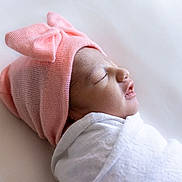 Ovi joined the competition — help win amazing prizes! newborn, baby, infant, sleeping, pink_hat, bow, swaddled, blanket, white, soft, cute, profile, peaceful, rest, child, headwear, portrait, closeup, indoors, baby_clothing