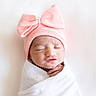 Ovi joined the competition — help win amazing prizes! newborn, baby, sleeping, hat, pink_bow, blanket, swaddled, infant, cute, peaceful, portrait, headwear, soft_lighting, indoors, closeup, child, tiny_hand, skin, resting, adorable