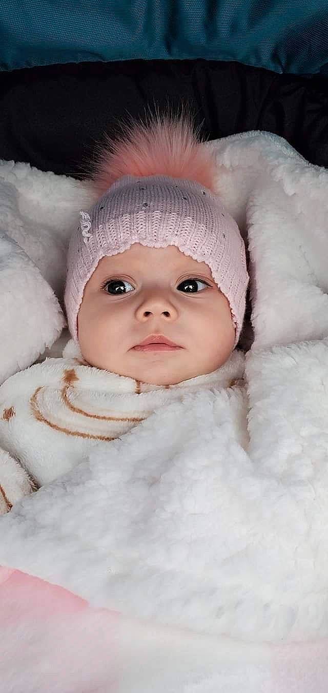 Alania is registered to the contest to win money with this photo: baby, beauty, cap, cheek, eye, eyelash, flash_photography, freezing, fun, fur, fur_clothing, happy, headwear, iris, jacket, knit_cap, lip, nose, person, skin