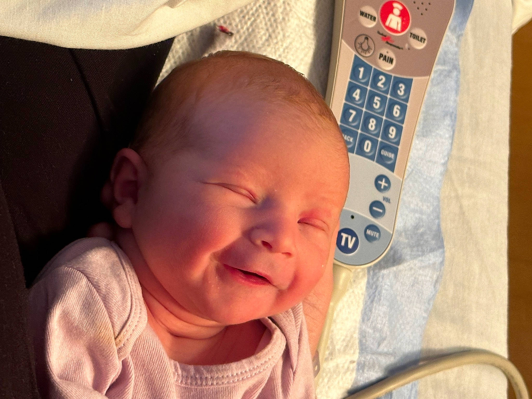 Audrey is registered to the contest to win money with this photo: baby, baby_laughing, baby_products, baby_toddler_clothing, cheek, child, ear, eyelash, fun, happy, laugh, lip, mouth, nose, person, product, room, sitting, skin, smile