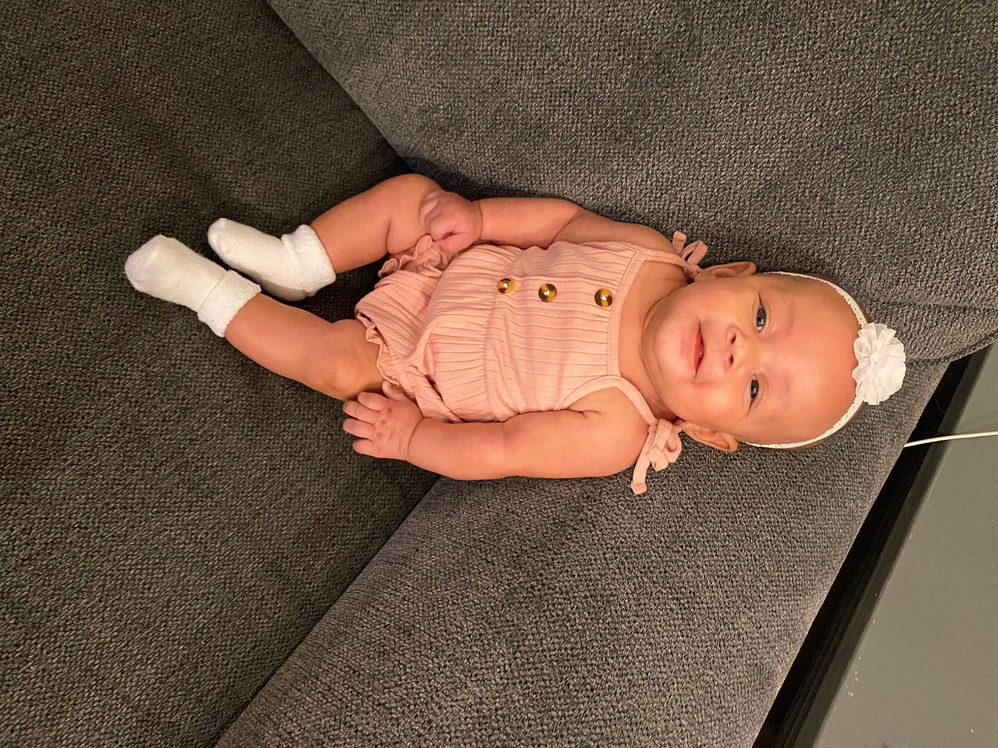 Legacy is registered to the contest to win money with this photo: baby, baby_products, baby_toddler_clothing, cheek, child, comfort, finger, flooring, foot, grass, human_body, human_leg, linens, pattern, person, skin, sleeve, thumb, toddler, wood