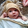 baby, blanket, child, cozy, curious, cute, expression, eyes, face, hands, hooded_towel, indoor, infant, newborn, person, portrait, skin, soft_texture, warm, wrapped