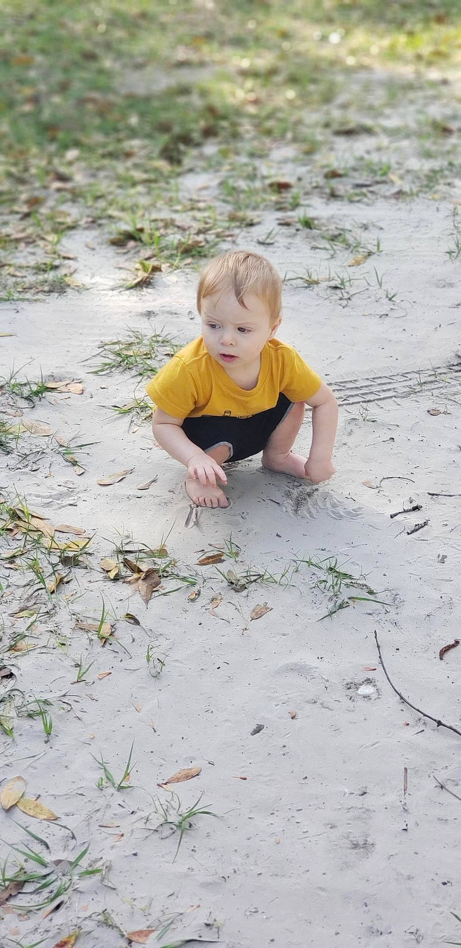 Ryker is registered to the contest to win money with this photo: child, fun, grass, mud, person, play, sand, soil, toddler, vacation