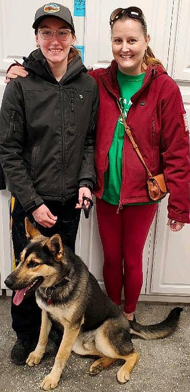 Max is registered to the contest to win money with this photo: belt, canidae, carnivore, clothing, companion_dog, dog, dog_breed, fashion_accessory, fawn, fur, herding_dog, jacket, jewellery, leash, luggage_and_bags, organ, pet_supply, sleeve, smile, sporting_group