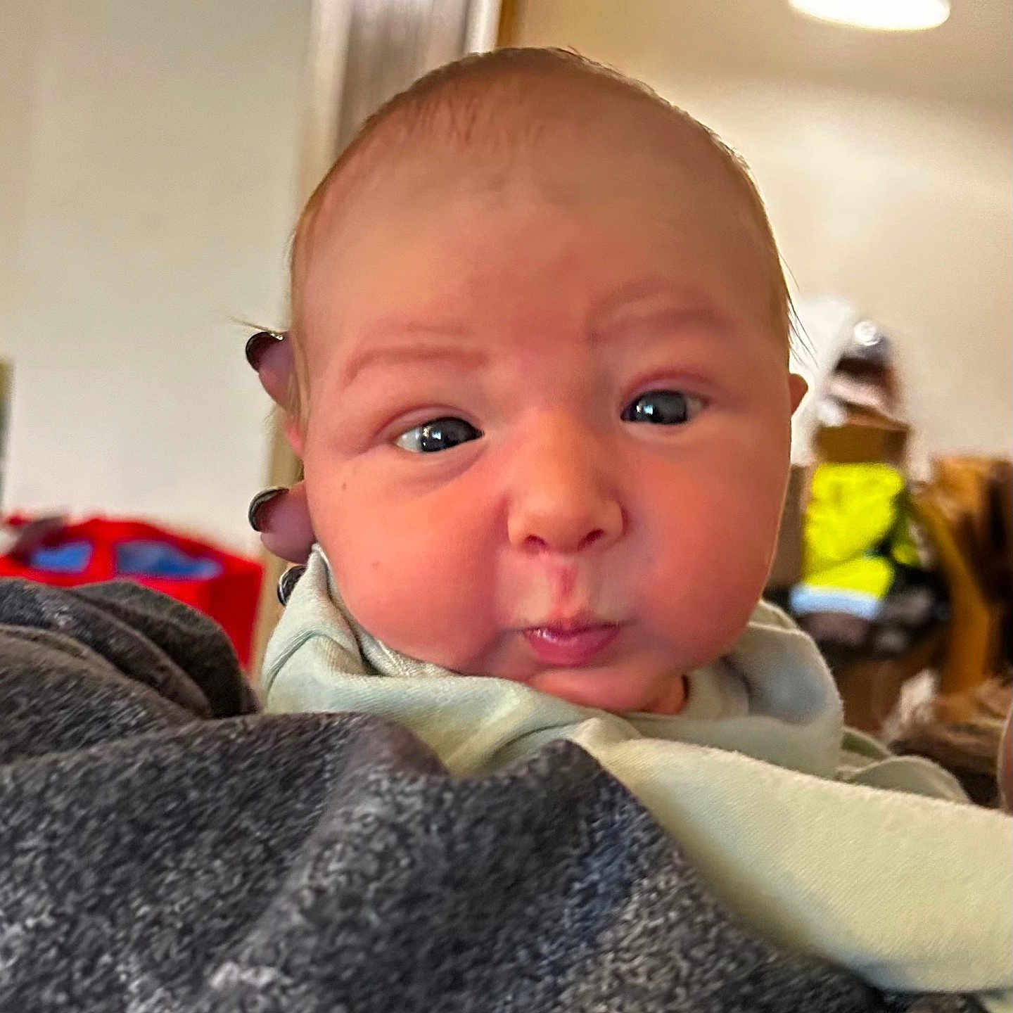 Hudson joined the competition — help win amazing prizes! baby, blanket, crying, face, frown, head, newborn, person, photography, portrait, sad