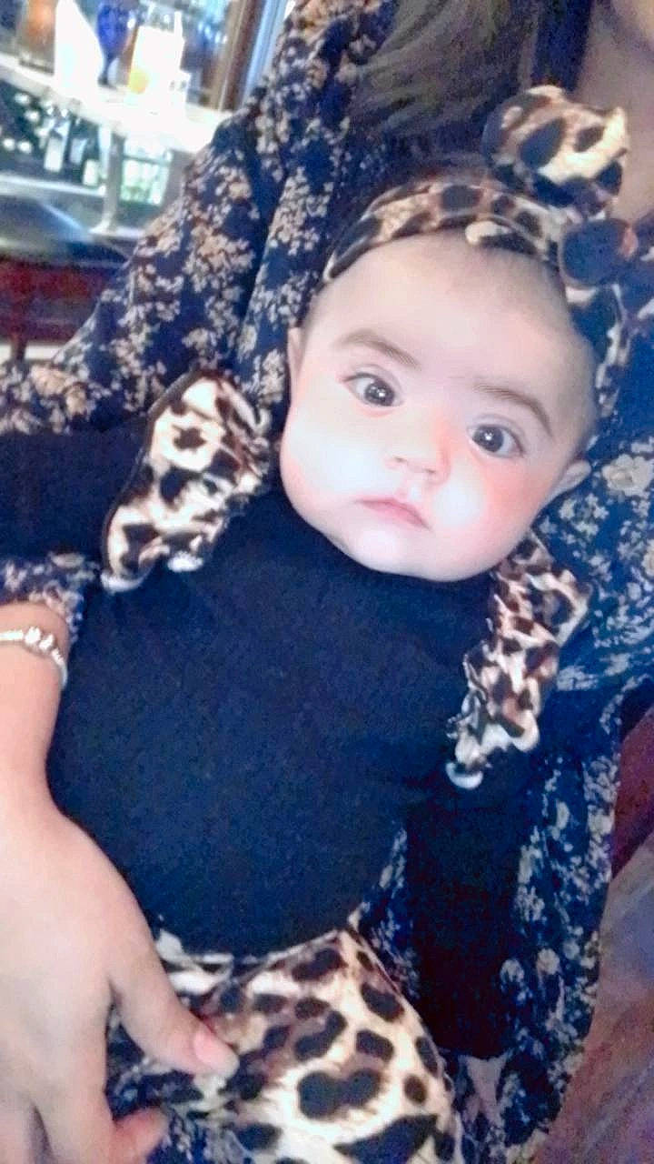 Karolina joined the competition — help win amazing prizes! baby, baby_toddler_clothing, blue, cap, child, cool, electric_blue, fun, fur, grass, happy, knit_cap, lip, pattern, person, plant, sitting, sleeve, t_shirt, toddler