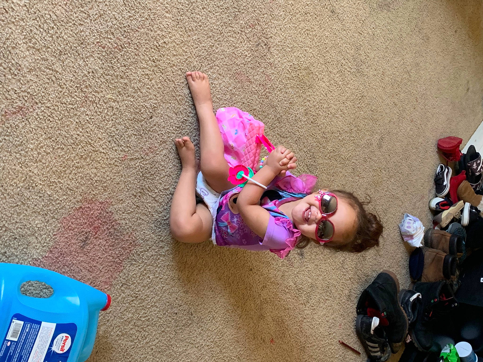 Maylynn Marie Burke joined the competition — help win amazing prizes! blue, child, doll, eyewear, fashion_accessory, foot, fun, human_leg, joy, knee, leisure, magenta, person, pink, plastic, play, recreation, sandal, shorts, swimwear