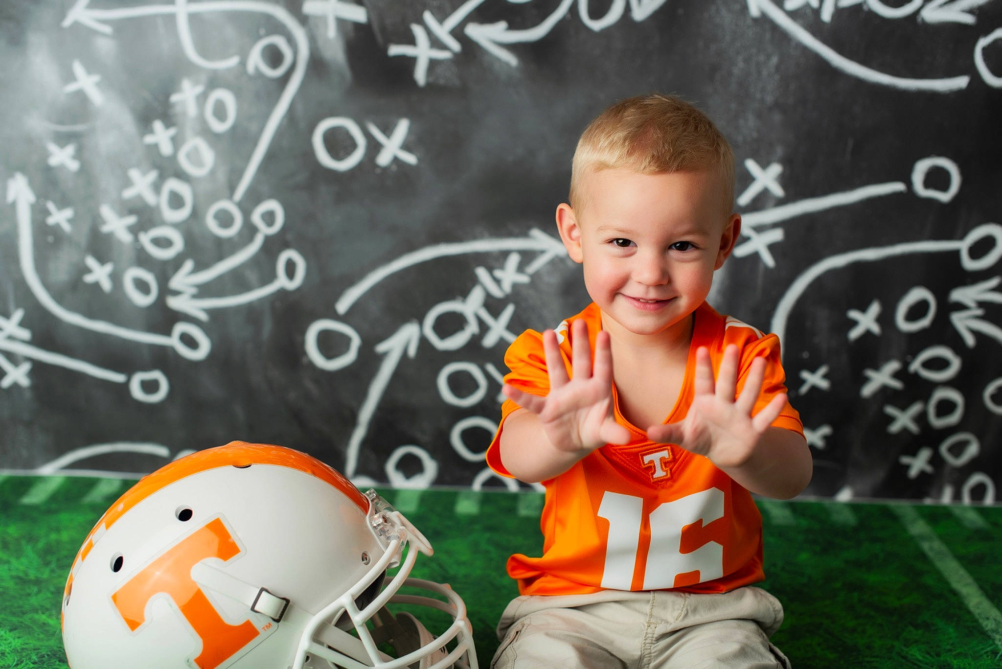 Neyland joined the competition — help win amazing prizes! baby, ball, child, football, fun, helmet, joy, person, personal_protective_equipment, play, room, smile, soccer_ball, sports_gear, toddler