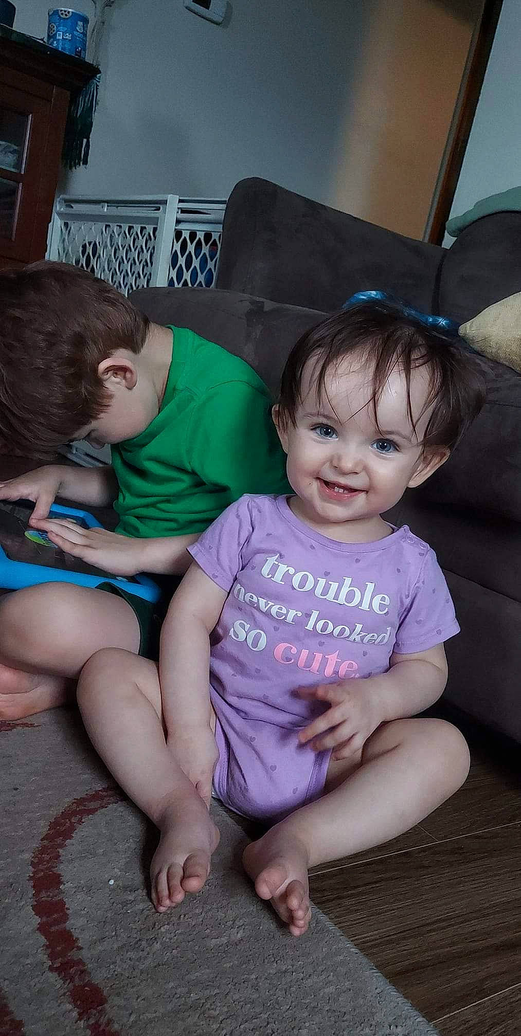 Evelyn is registered to the contest to win money with this photo: baby_toddler_clothing, cheek, comfort, couch, face, facial_expression, hair, hairstyle, happy, head, human_body, interaction, iris, joy, lap, mouth, person, product, skin, smile