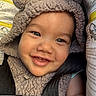 baby, smiling, face, hood, car_seat, safety_belt, child, infant, cute, happy, clothing, fuzzy, ears, closeup, young_child, seatbelt, portrait, adorable, infant_clothing, car_seat_warning