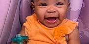 Kiara joined the competition — help win amazing prizes! baby, infant, smiling, orange_outfit, pacifier, car_seat, purple, child, cute, happy, portrait, indoors, clothing, seat, person, baby_girl, expression, joy, young, sitting