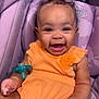 baby, infant, smiling, orange_outfit, pacifier, car_seat, purple, child, cute, happy, portrait, indoors, clothing, seat, person, baby_girl, expression, joy, young, sitting