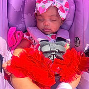 Kiara joined the competition — help win amazing prizes! baby, sleeping, car_seat, purple, red_tutu, headband, strawberry_pattern, infant, clothing, safety_harness, cute, adorable, child, sunlight, pink, white_socks, seat_belt, toddler, portrait, resting
