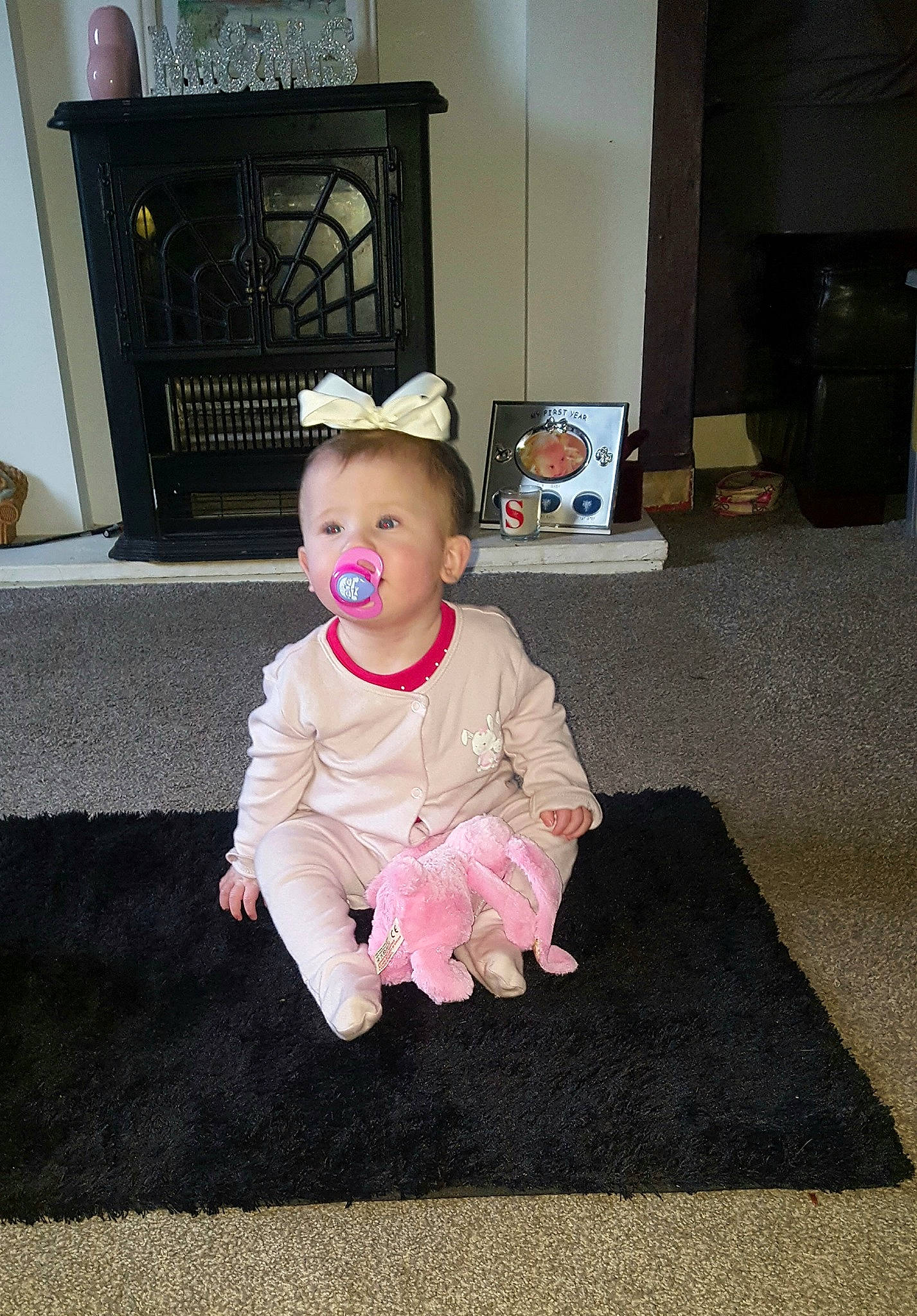 Lacey-mae is registered to the contest to win money with this photo: baby, child, costume, crawling, dress, electronic_device, floor, flooring, fun, joy, person, pink, room, shoe, sitting, smile, technology, toddler