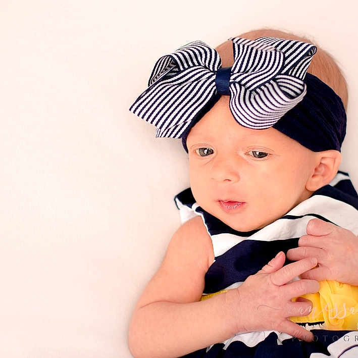 Mayzie joined the competition — help win amazing prizes! baby, baby_bloomers, baby_toddler_clothing, beanie, cap, child, clothing, costume_accessory, costume_hat, fashion_accessory, hair_accessory, headband, headgear, headpiece, person, toddler, yellow