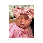 Halo is registered to the contest to win money with this photo: baby, newborn, sleeping, pink, headband, bow, knitted, sweater, closeup, infant, soft, cute, face, peaceful, portrait, child, resting, indoors, cozy, warm