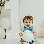 Zoren joined the competition — help win amazing prizes! baby, balloon, denim_overalls, barefoot, birthday, celebration, child, cute, decor, expression, face, floor, fun, happy, indoor, light, number_one, overalls, person, smile