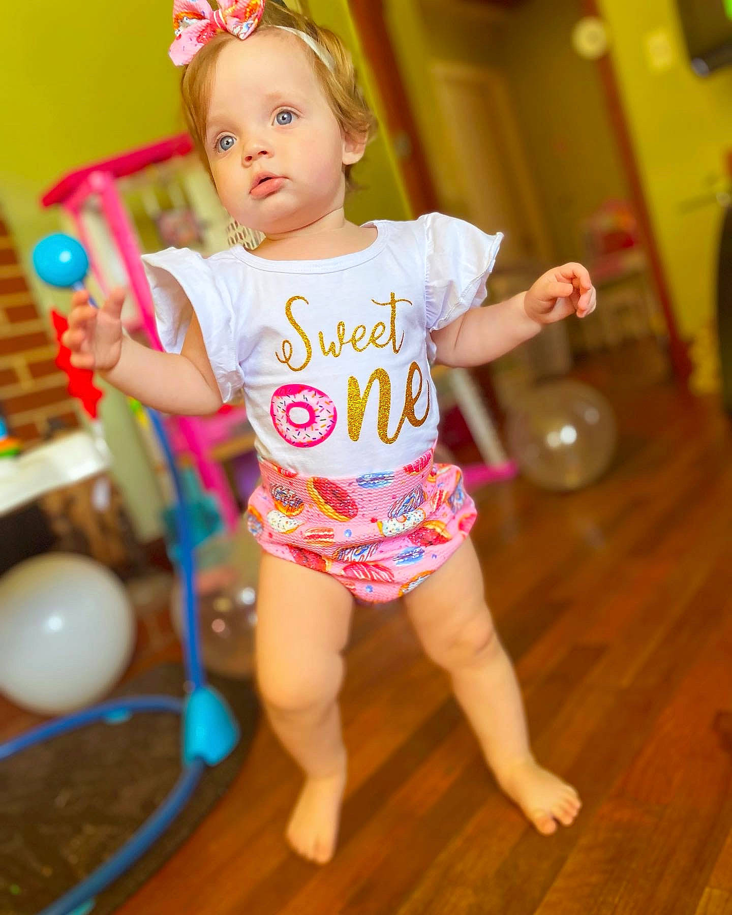 Kaisley joined the competition — help win amazing prizes! baby, baby_toddler_clothing, barefoot, cheek, child, flooring, fun, happy, hardwood, hat, human_leg, magenta, pattern, person, pink, sitting, skin, sleeve, thigh, toddler