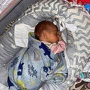 Sadie Mae joined the competition — help win amazing prizes! newborn, baby, sleeping, blanket, dinosaur_pattern, baby_lounger, gray, zigzag_pattern, cozy, indoor, infant, cute, peaceful, wrapped, head, face, pink_clothing, soft, resting, child
