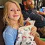 Rhyleigh-ann joined the competition — help win amazing prizes! child, baby, newborn, blanket, footprints, hat, smile, person, indoor, family, beard, braid, tshirt, couch, relaxing, holding, blond_hair, blue_shirt, wooden_door, clothing