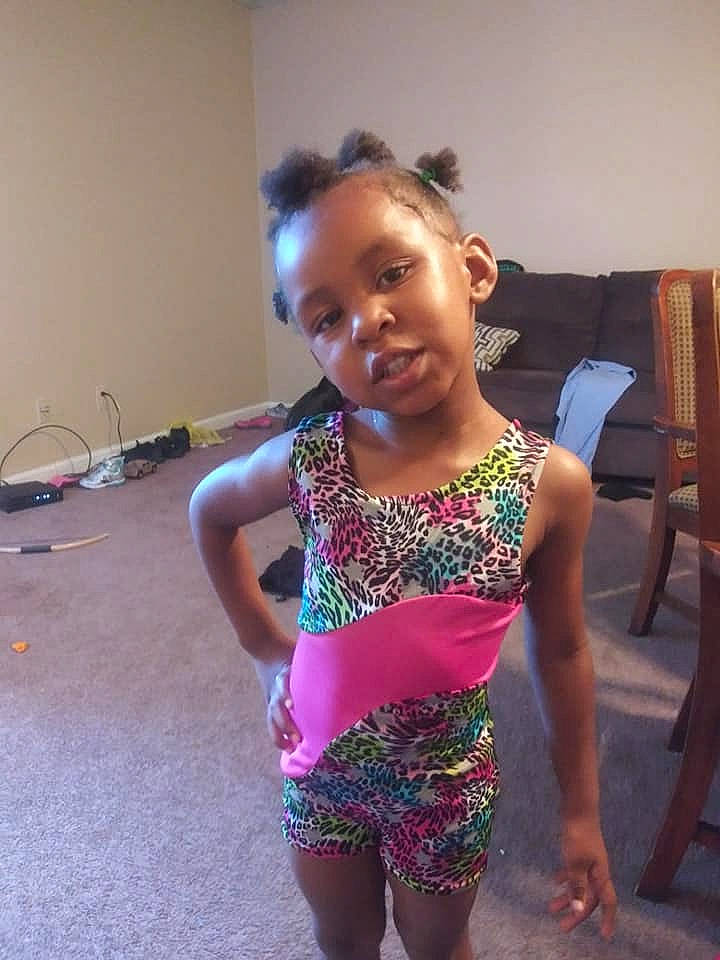 Beauty is registered to the contest to win money with this photo: active_tank, baby_toddler_clothing, barefoot, child, lamp, leotard, maillot, monokini, nightwear, one_piece_garment, one_piece_swimsuit, person, swimwear, tankini