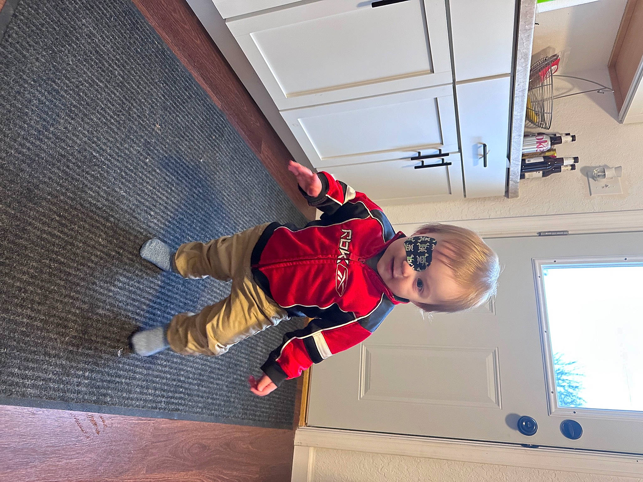 Bodhi is registered to the contest to win money with this photo: adventure, carmine, ceiling, comfort, daylighting, flooring, fun, hardwood, leisure, pattern, person, recreation, room, square, toddler, walking_shoe, window, wood