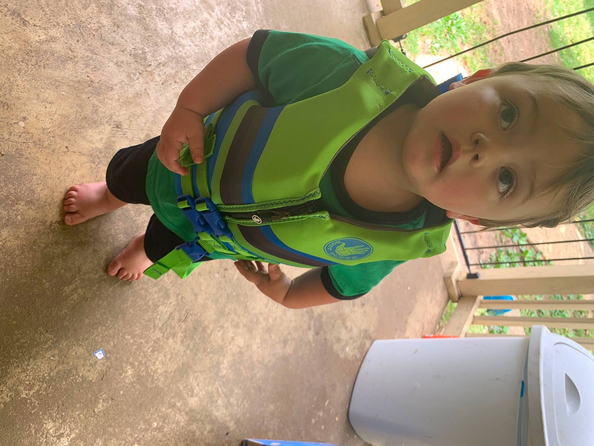 Holden is registered to the contest to win money with this photo: baby, baby_products, baby_toddler_clothing, child, eye, fun, grass, happy, head, human_leg, landscape, leisure, pattern, people_in_nature, person, personal_protective_equipment, play, recreation, surprise, thigh