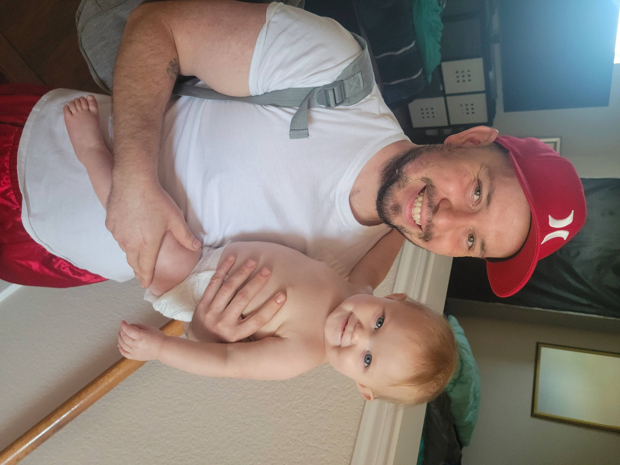 Chloe is registered to the contest to win money with this photo: abdomen, chest, child, comfort, elbow, event, fun, gesture, happy, headwear, human_leg, joint, joy, mouth, muscle, person, shoulder, smile, television, thigh