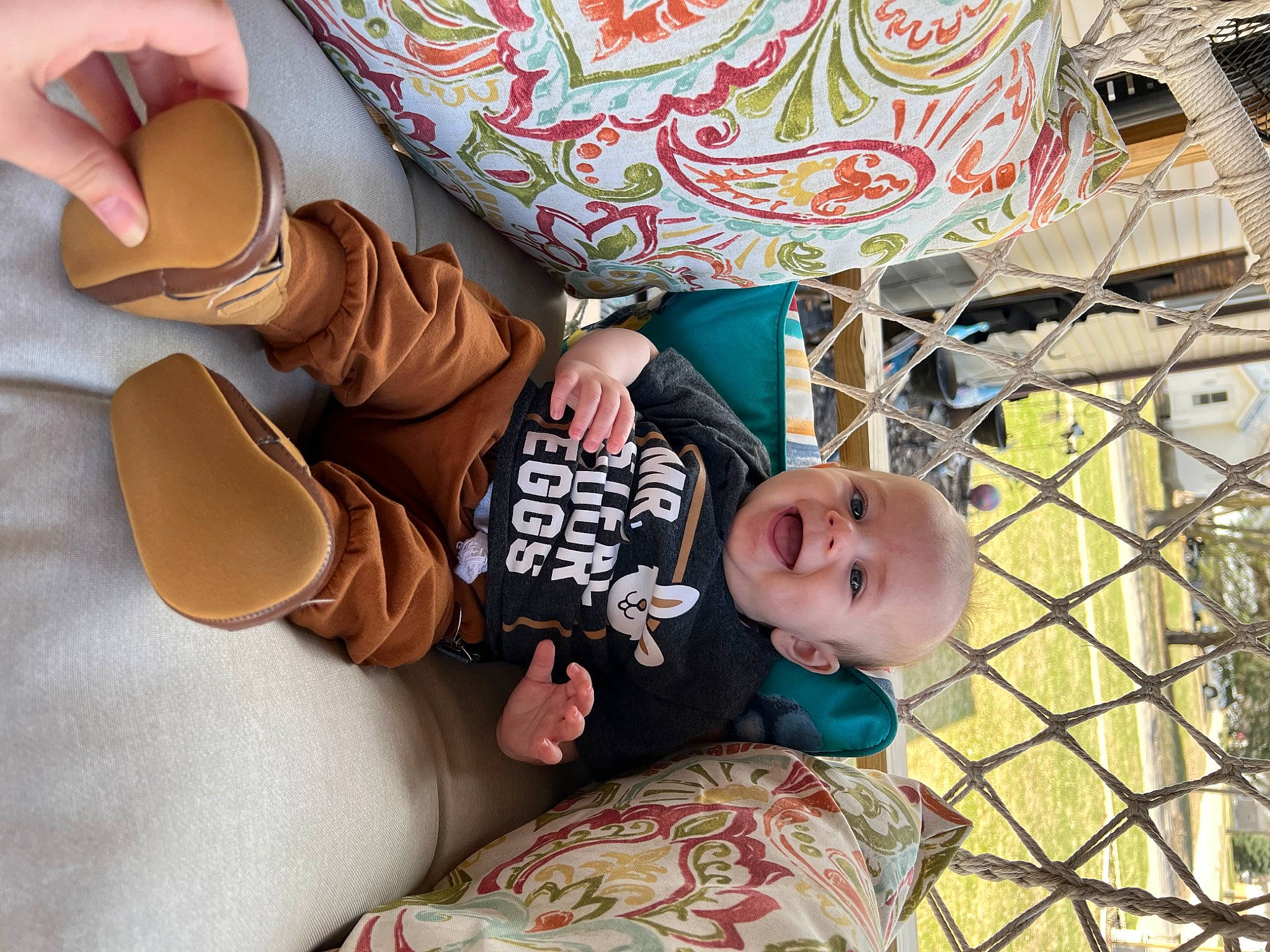 Brooks is registered to the contest to win money with this photo: baby, baby_products, baby_toddler_clothing, bag, child, comfort, fashion_accessory, fun, grass, happy, hat, leg, leisure, linens, pattern, person, sitting, sunglasses, t_shirt, toddler