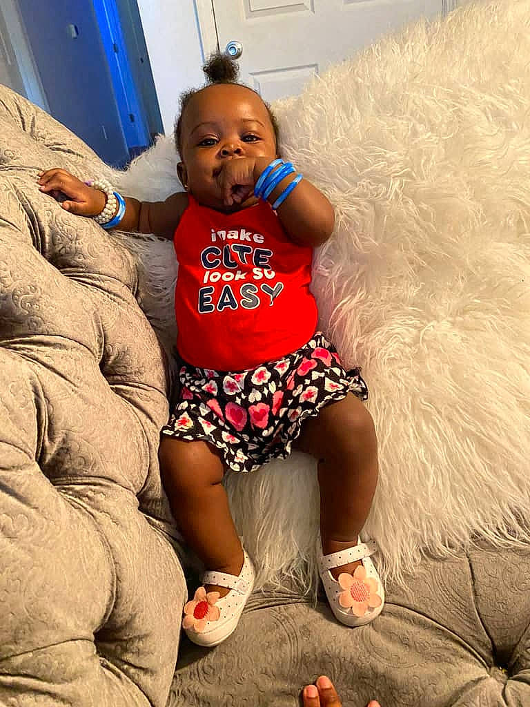 Camille joined the competition — help win amazing prizes! arm, baby, barefoot, blue, comfort, couch, event, flooring, foot, fun, happy, human_body, human_leg, leg, leisure, person, sandal, t_shirt, thigh, toddler