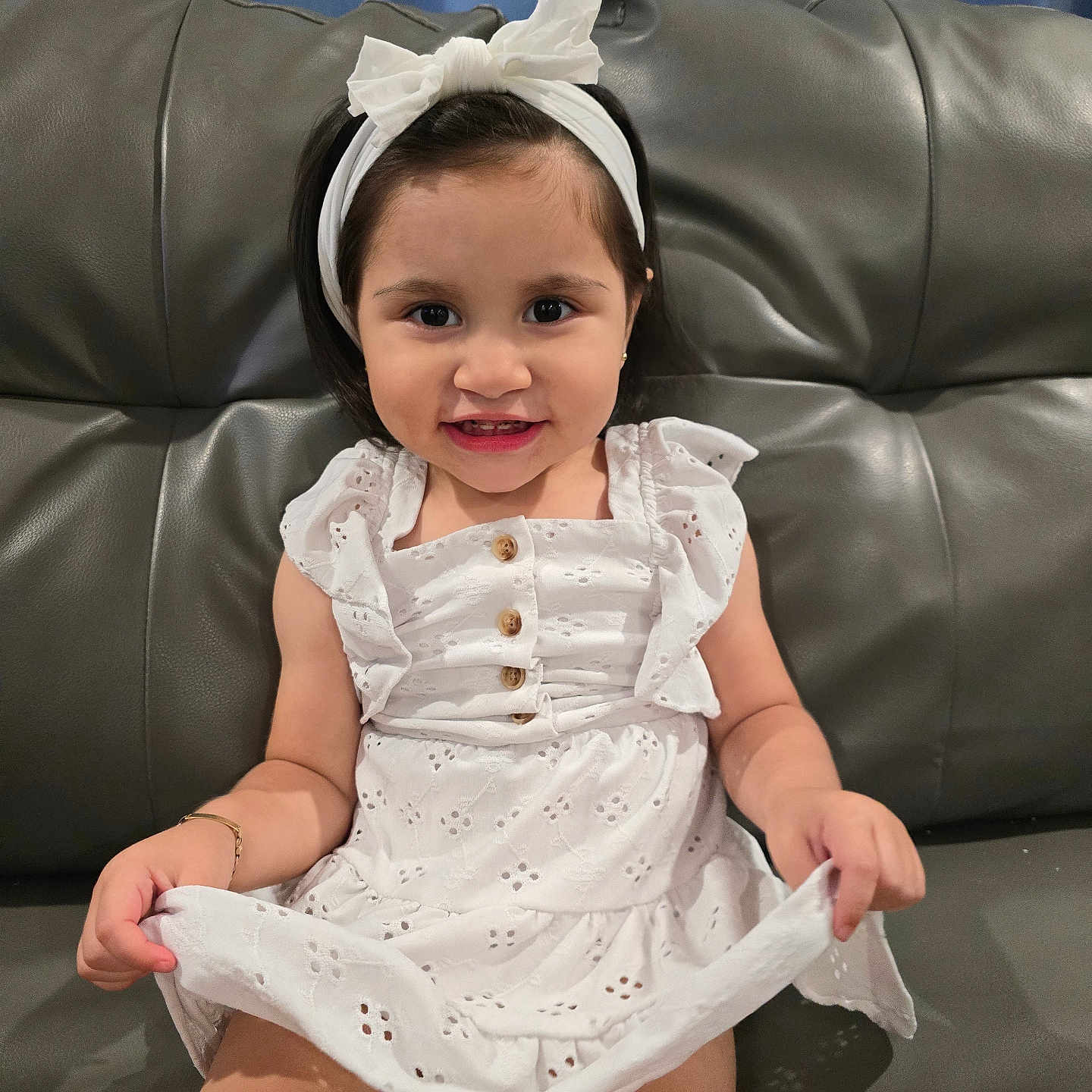Melody is registered to the contest to win money with this photo: accessories, architecture, baby, building, clothing, couch, cushion, dress, face, furniture, hat, head, homedecor, indoors, livingroom, person, photography, portrait, room, sitting
