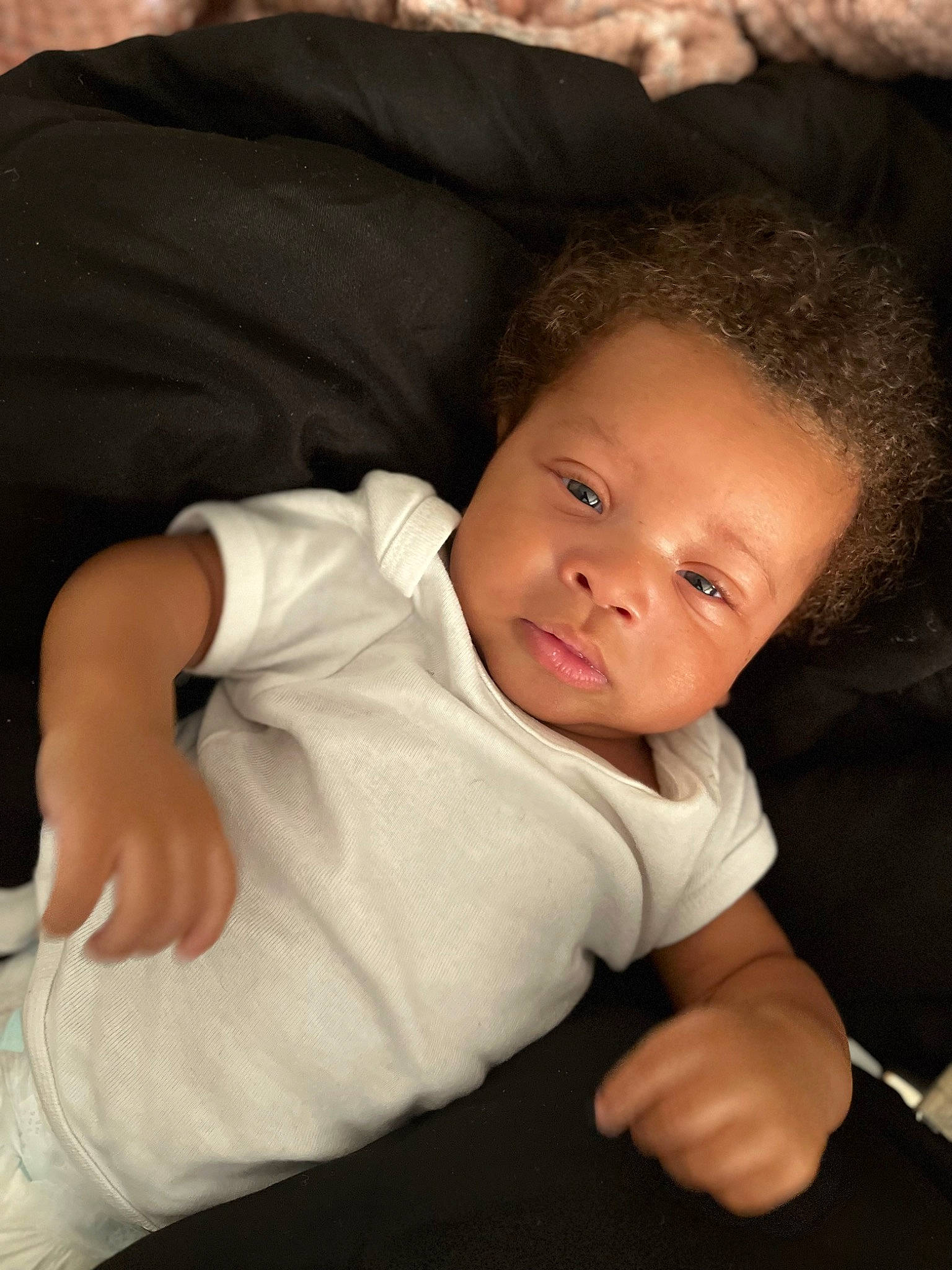 Kevin is registered to the contest to win money with this photo: baby, baby_toddler_clothing, cheek, child, chin, comfort, elbow, eye, flash_photography, head, iris, lip, nose, person, room, sitting, skin, sleeve, thumb, toddler