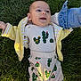 Matthew is registered to the contest to win money with this photo: baby, baby_clothes, cactus_pattern, casual, child, clothing, cute, denim, grass, green, happy, infant, lying_down, nature, outdoor, playful, portrait, smile, sunlight, yellow_jacket