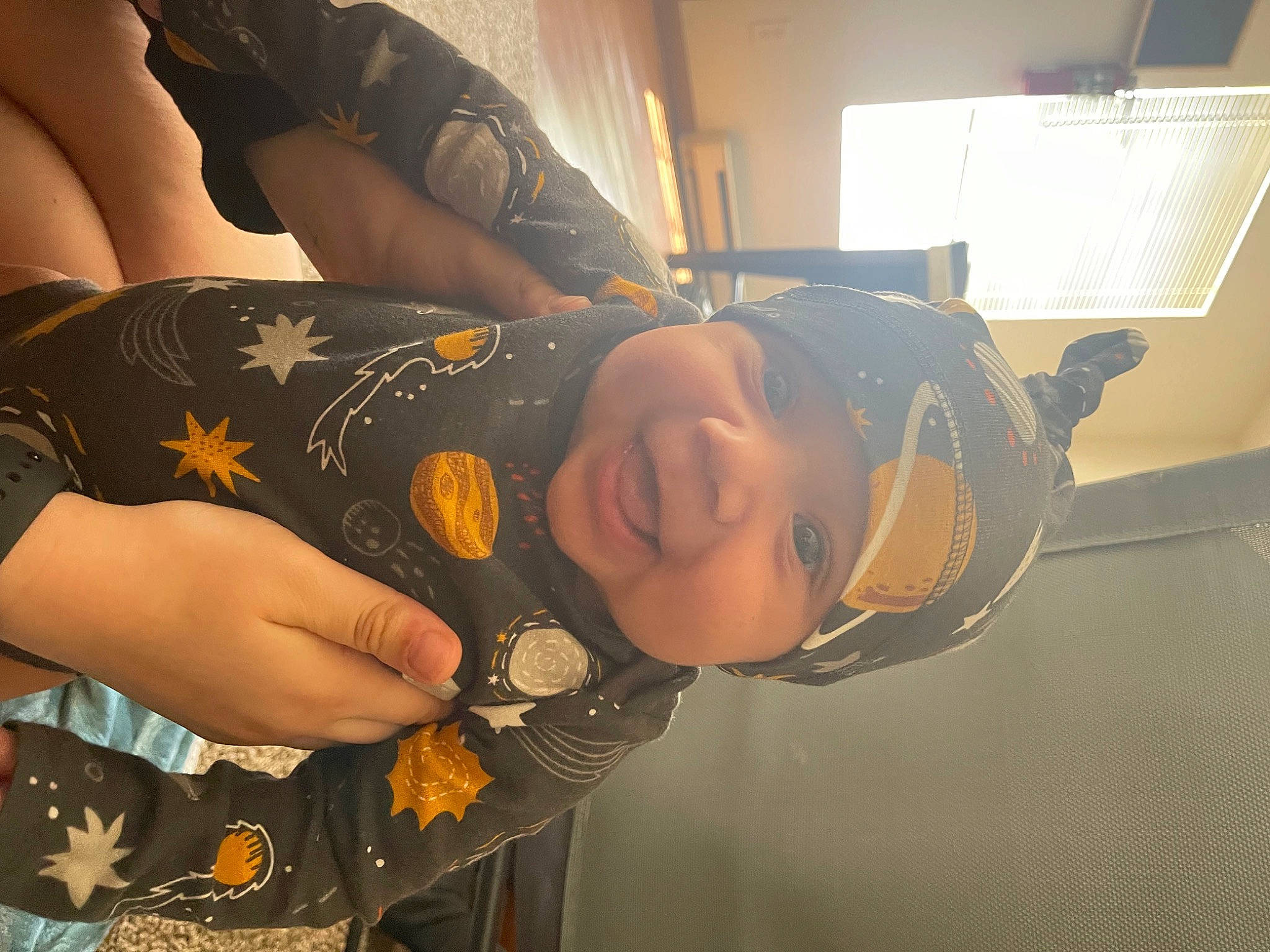 Darrell is registered to the contest to win money with this photo: abdomen, black_hair, chest, cool, elbow, eyewear, finger, gesture, hairstyle, happy, headwear, human_leg, jewellery, nail, pattern, person, smile, thigh, thumb, toddler