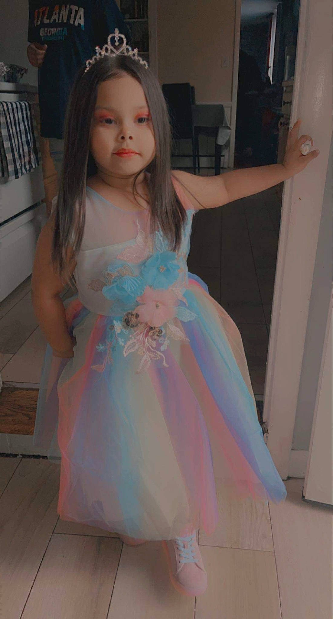 Nalani is registered to the contest to win money with this photo: bridal_party_dress, cool, day_dress, dress, facial_expression, fashion_design, flooring, formal_wear, gown, hair, happy, head, iris, one_piece_garment, person, pink, skin, standing, toddler, trunk